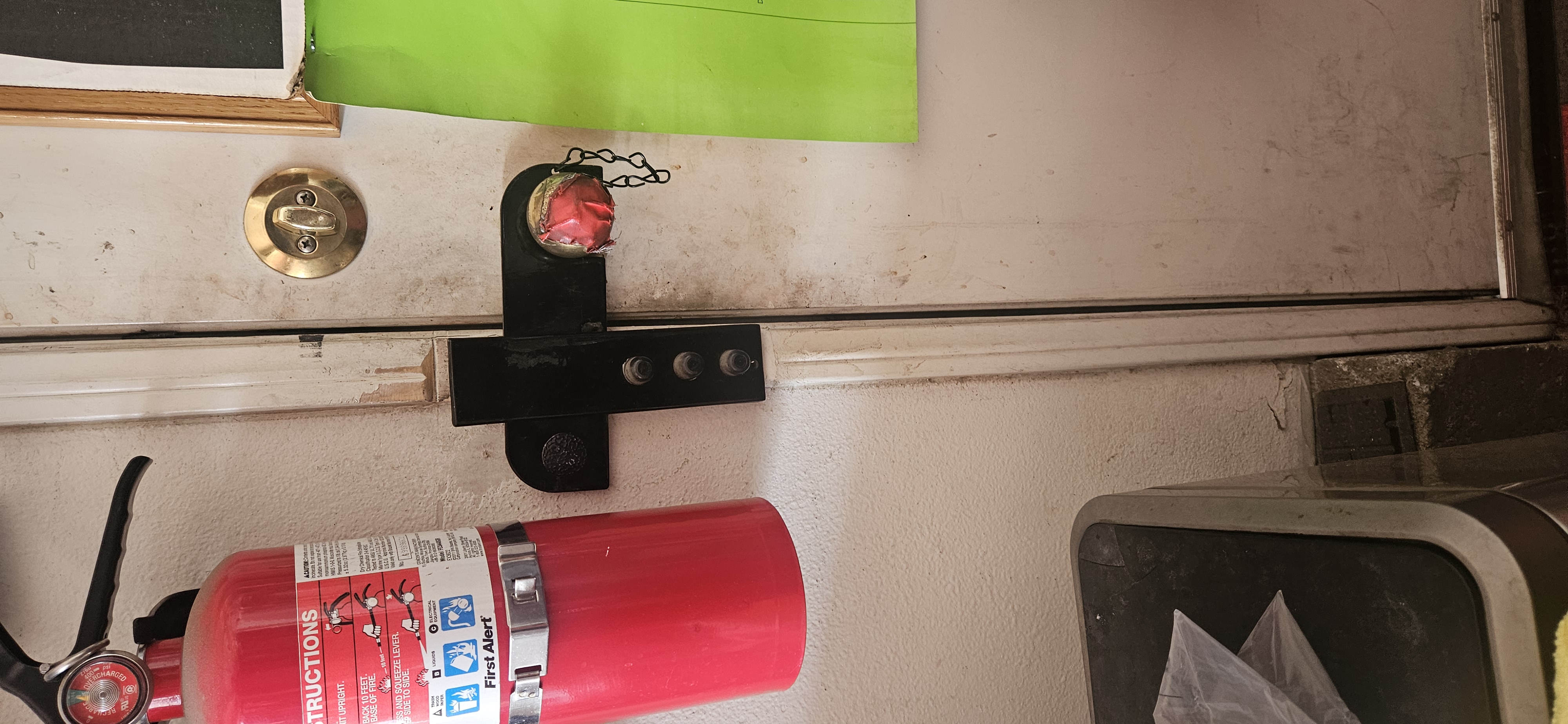 Single Home Security Door Cuff close-up on door